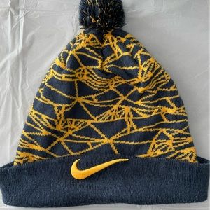 Navy blue and gold yellow Nike beanie hat with pom pom